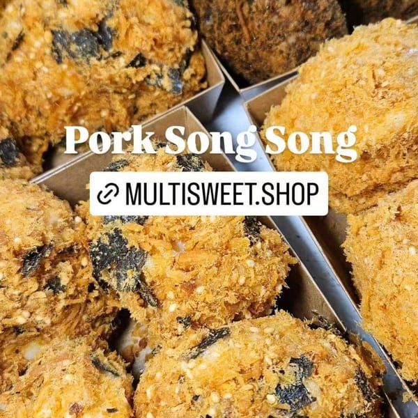 Close-up of Studio Multisweet's Pork Song Song, a dessert with a crispy, golden-brown topping and dark filling.